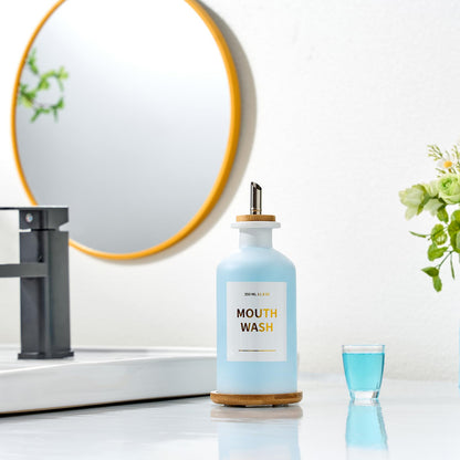 MUVEKA Glass Mouthwash Dispenser | 11.8oz, Bamboo Holder, Stainless Steel Spouts